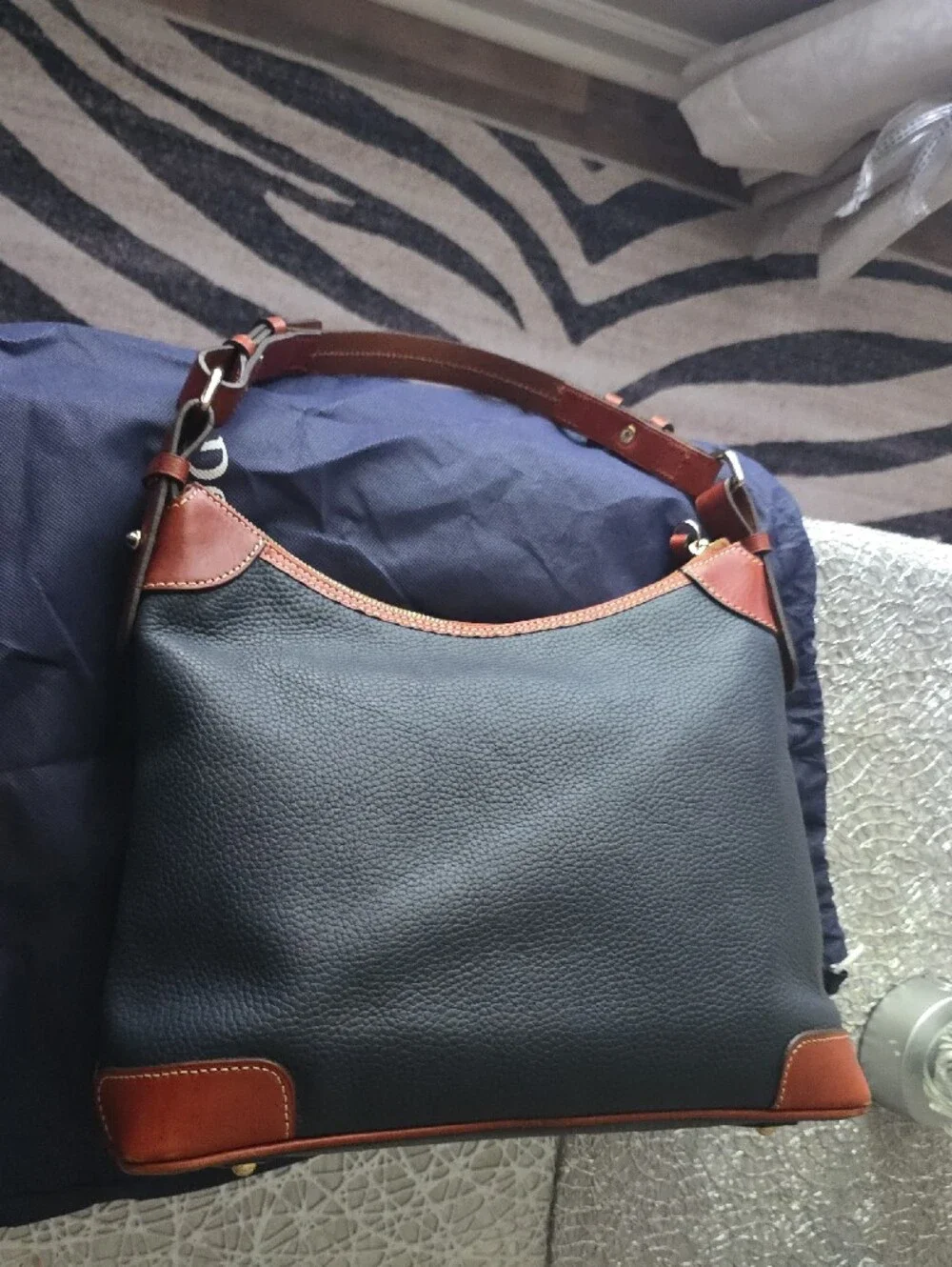 Dooney & Bourke Black Pebble Leather Messenger Bag with Brown Trim